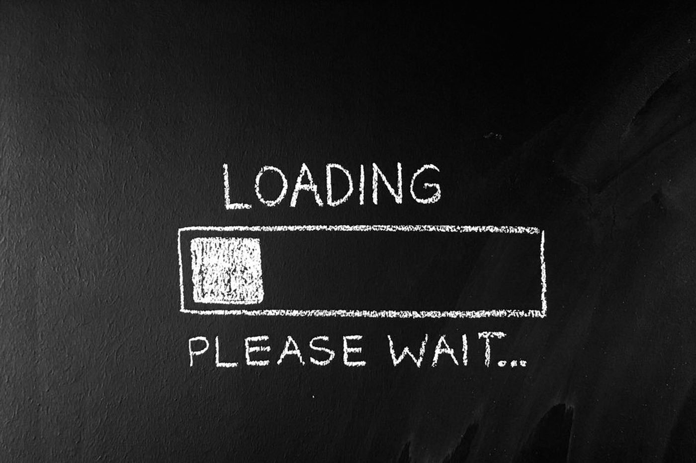 A picture of a black board that says loading